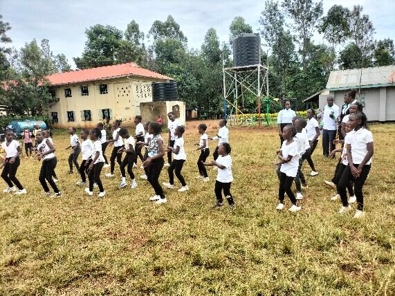 Learners performing a traditional dance at school