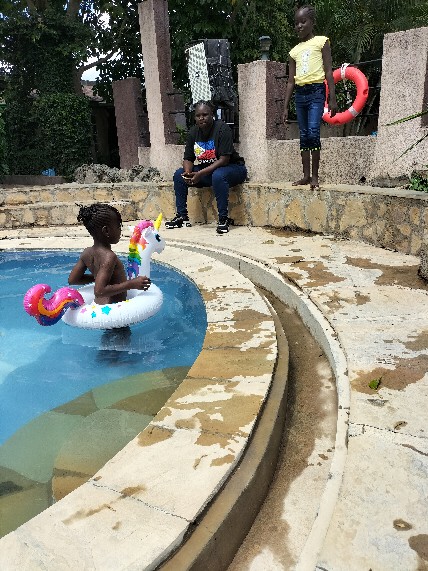 A young learner enjoying a pool outing on a unicorn float