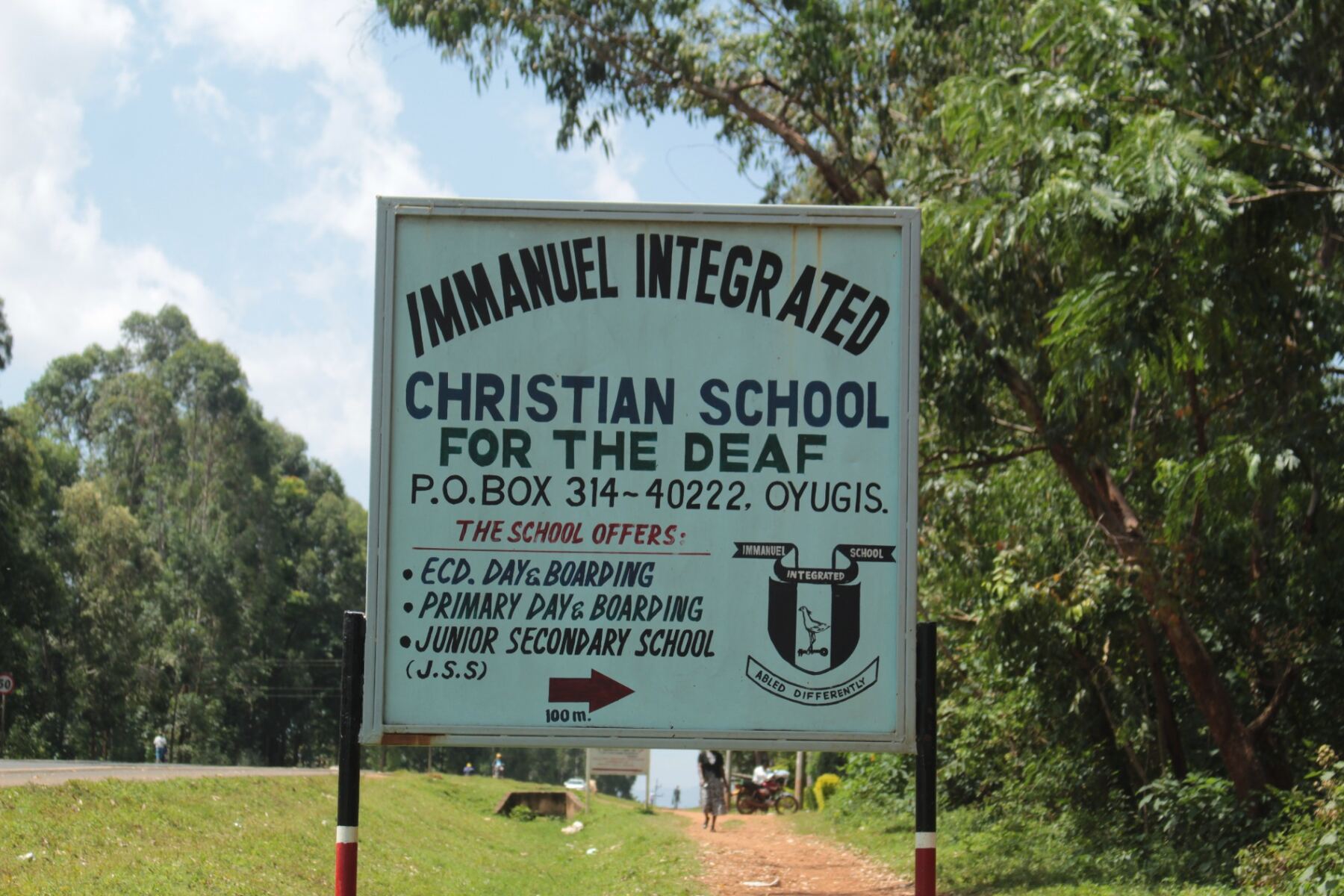Signpost by the road pointing to Immanuel Integrated Christian School for the Deaf for the Deaf