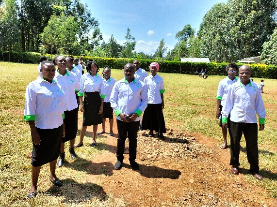 School staff posing together on the field