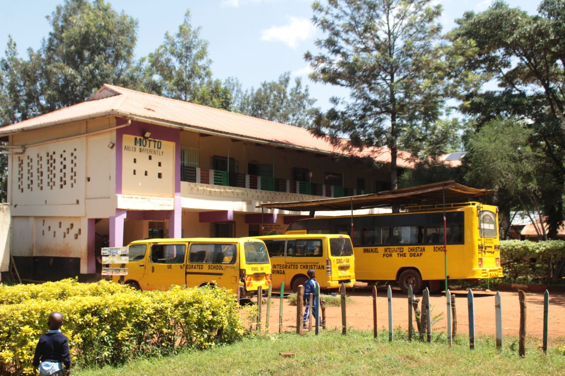 Teacher leading a lively classroom of deaf students